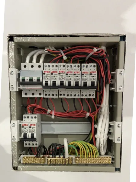 Expert technician inspecting and upgrading residential switchboard system